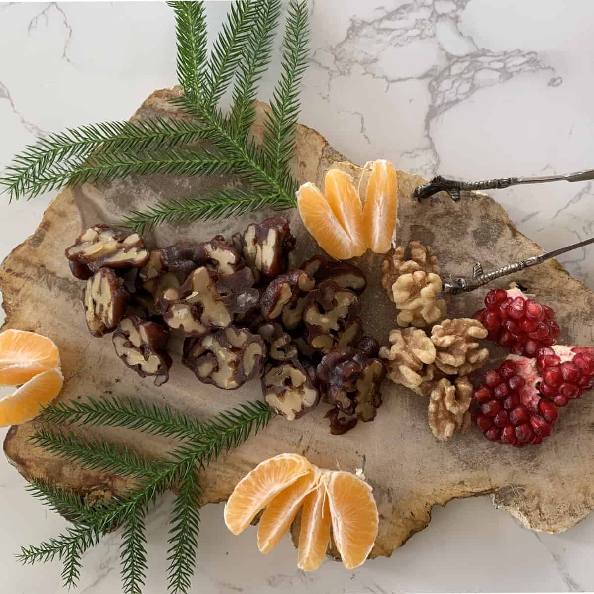 Sharan with mandarin and pomegranate.