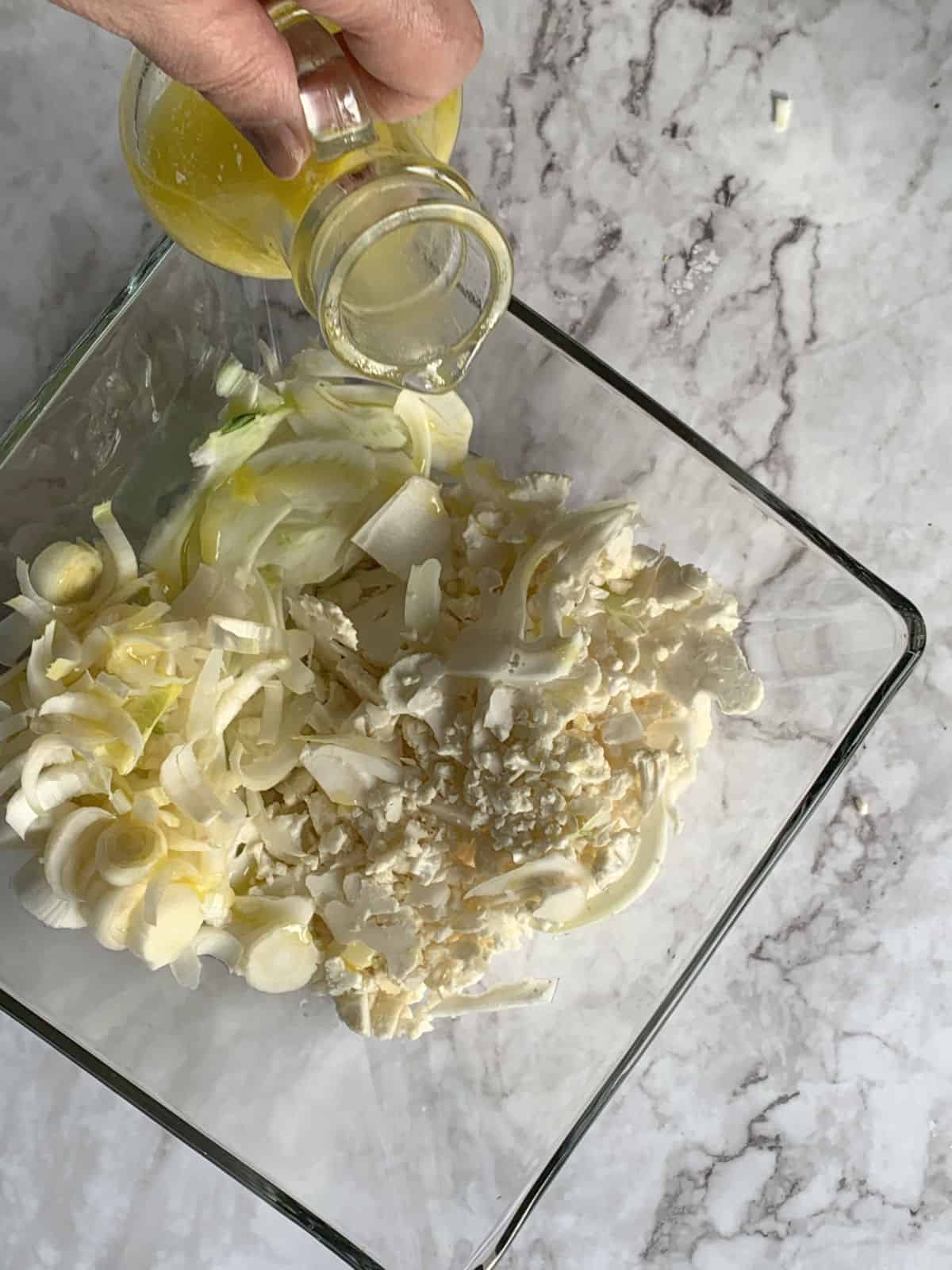 Shaved Cauliflower and Endive Salad in a glass bowl.