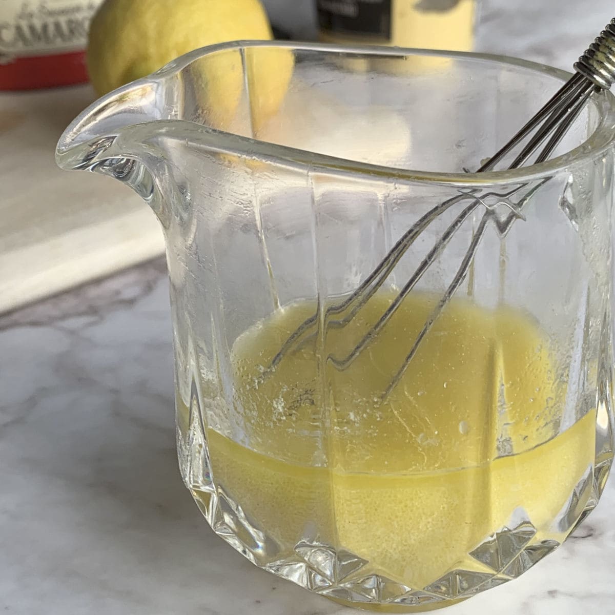 Mixing salad dressing in a jar.