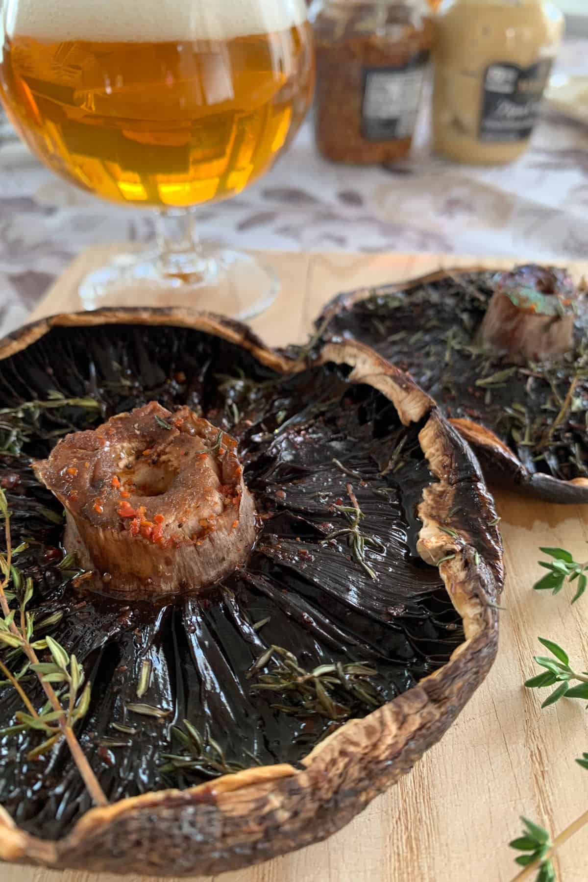 Smoked portobello mushroom on a serving board.