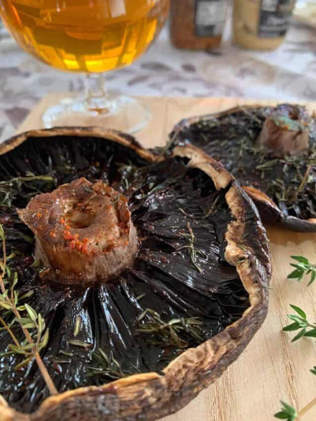 Smoked portobello mushroom on a serving board.