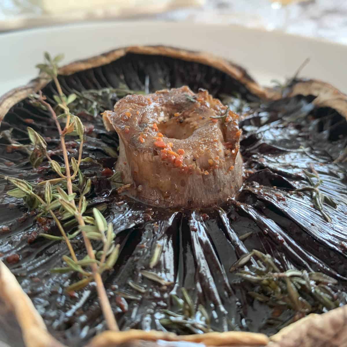 Smoked portobello mushroom on a plate.