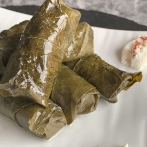 Grape leaf tolma with yogurt.