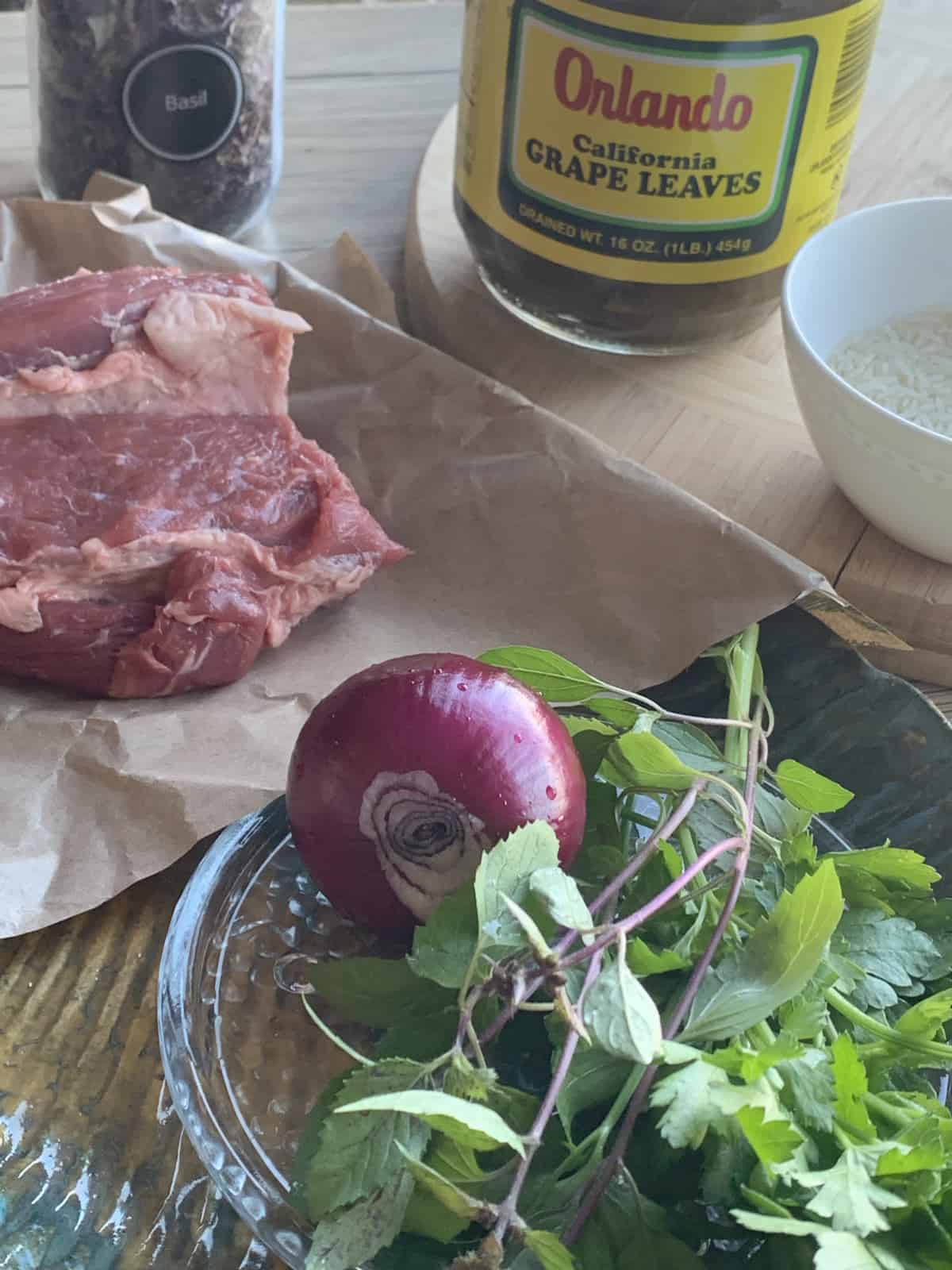 Ingredients for meat tolma with grape leaves.