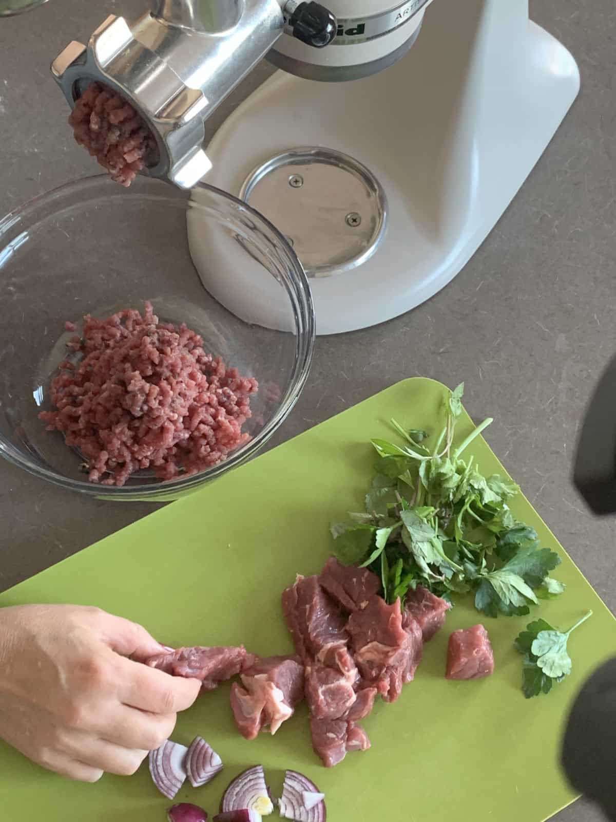 Grinding the meat.