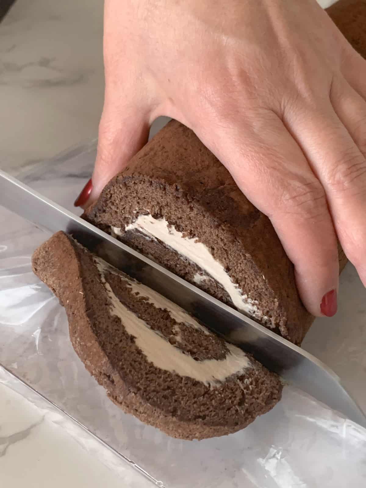 Cutting the end of the cake.