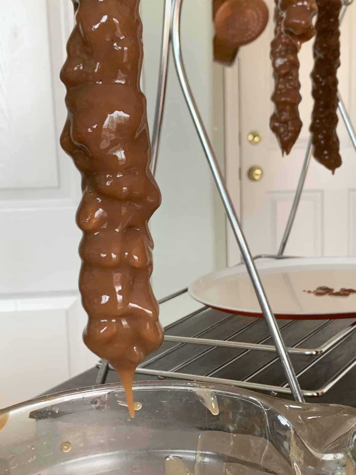 Hanging the dipped walnuts stings.