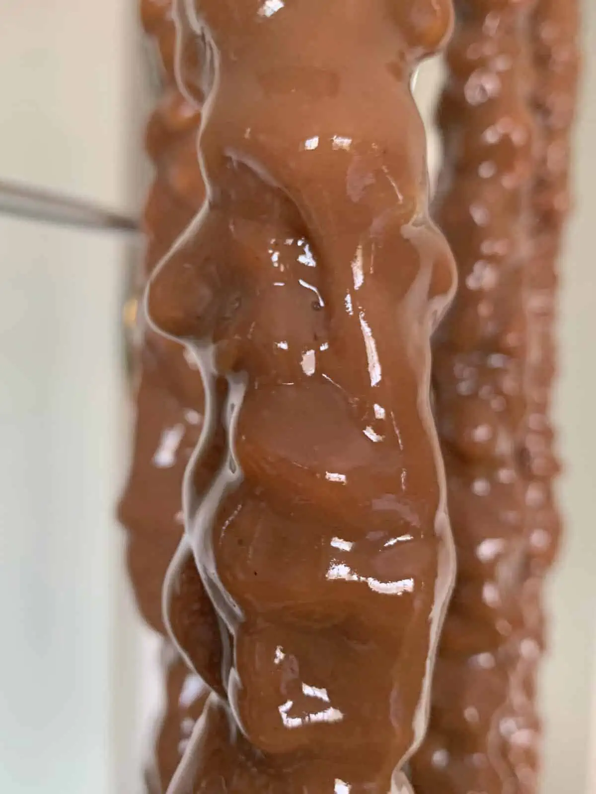 Freshly dipped sweet sujukh is hanging.