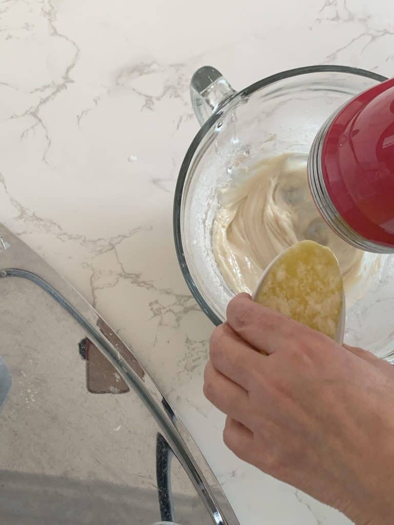 Adding melted butter.