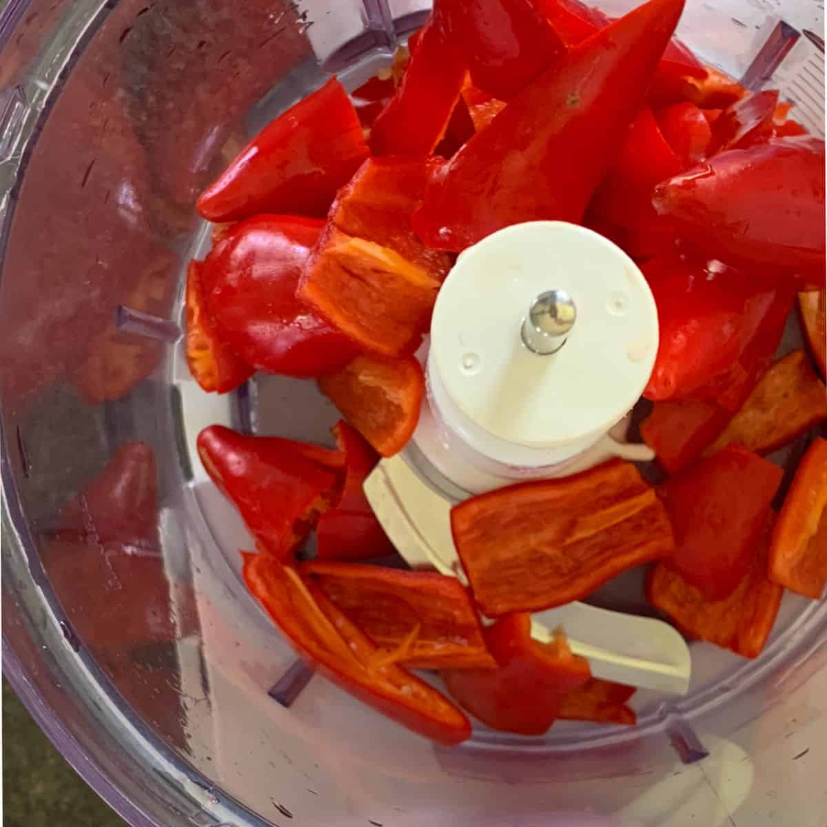 Fresno chili peppers in a food processor.