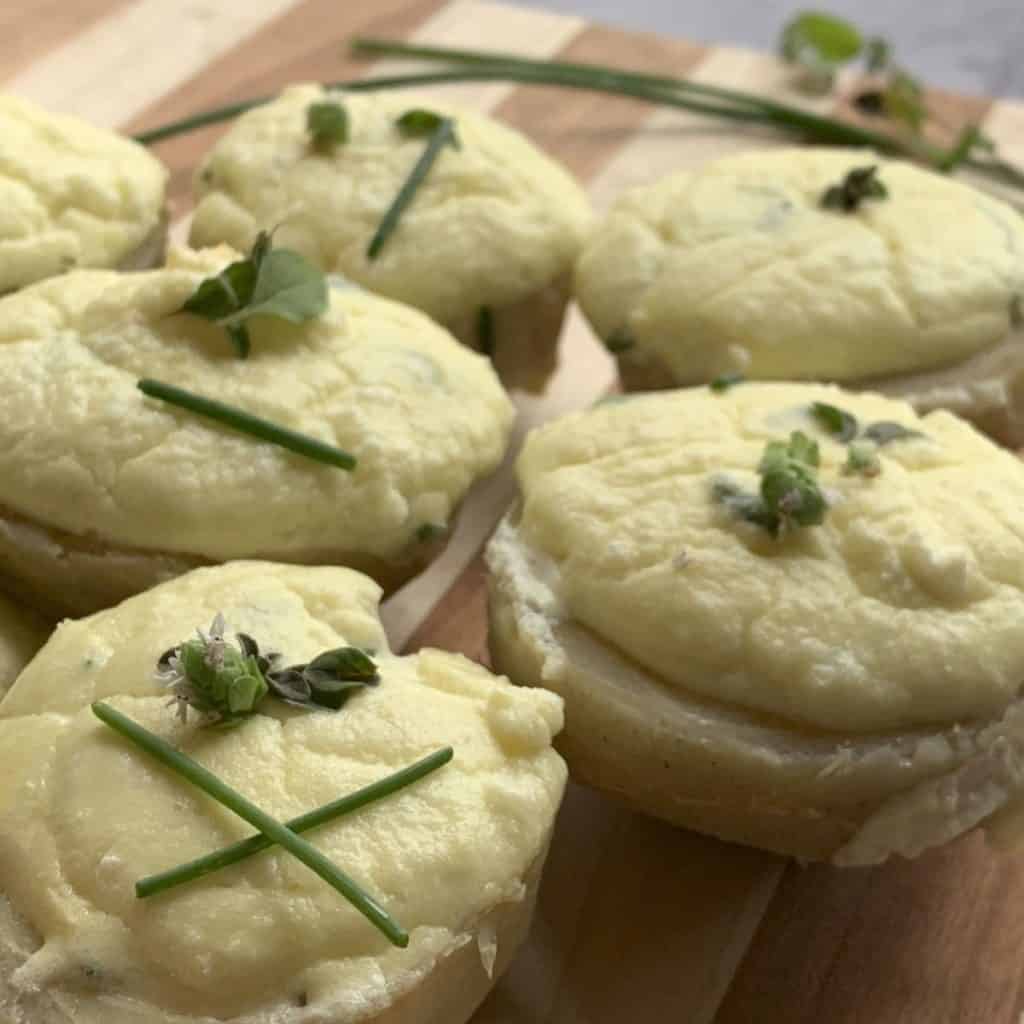 Close up of the artichoke bottoms filled with goat cheese souffle.
