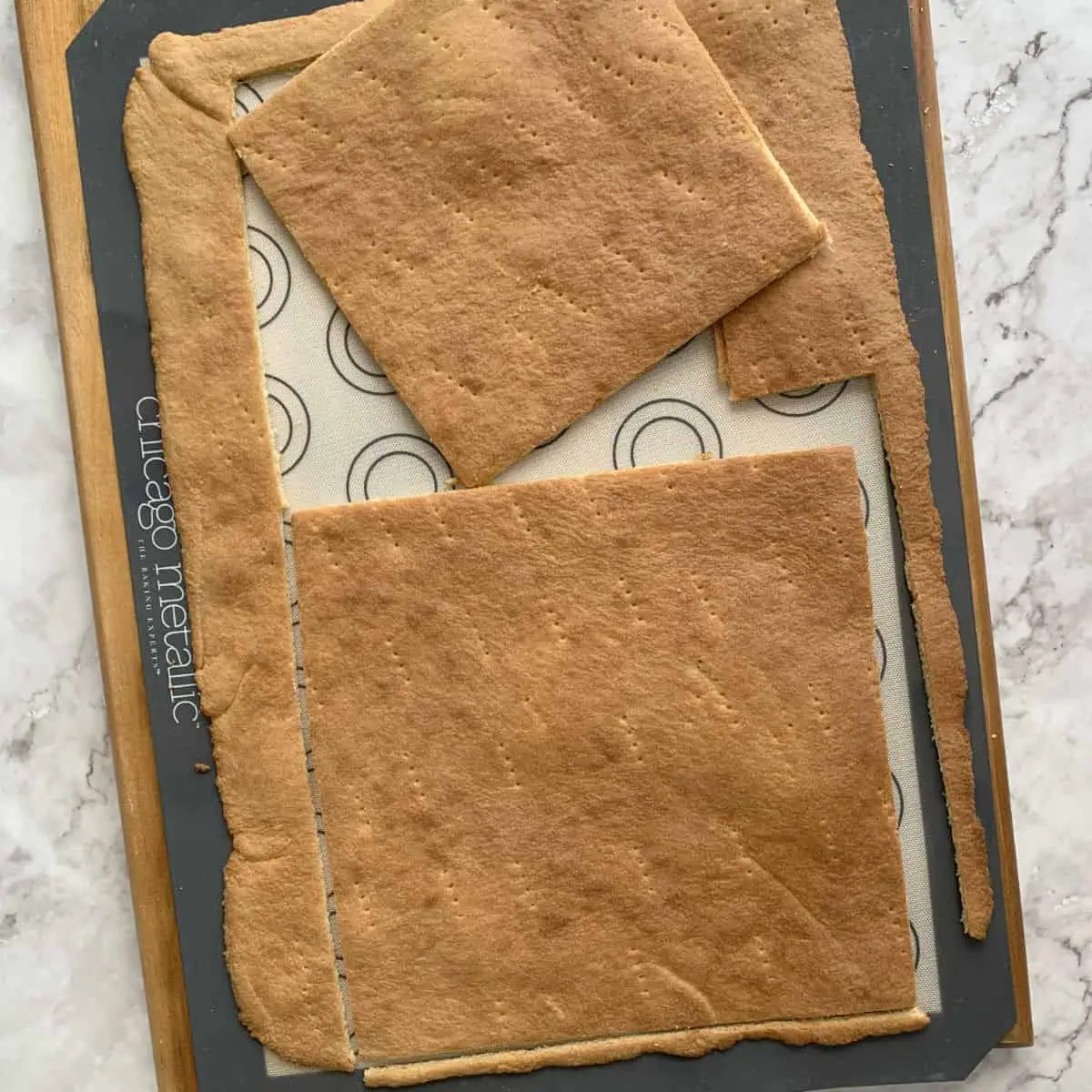 Cutting the baked sheet cake to desired size.