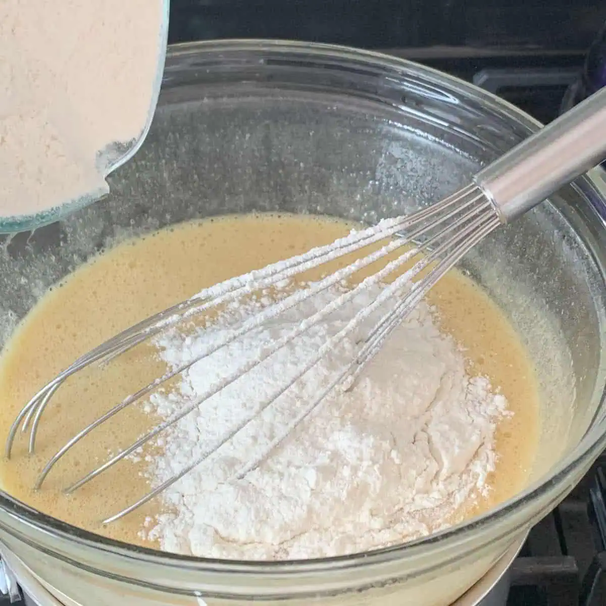 Folding in the flour.