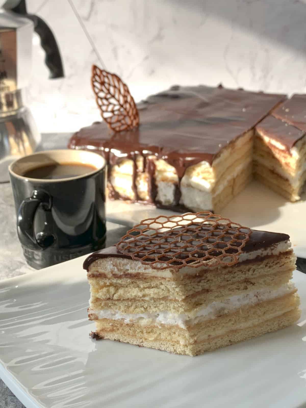 Piece of birds milk cake and coffee.