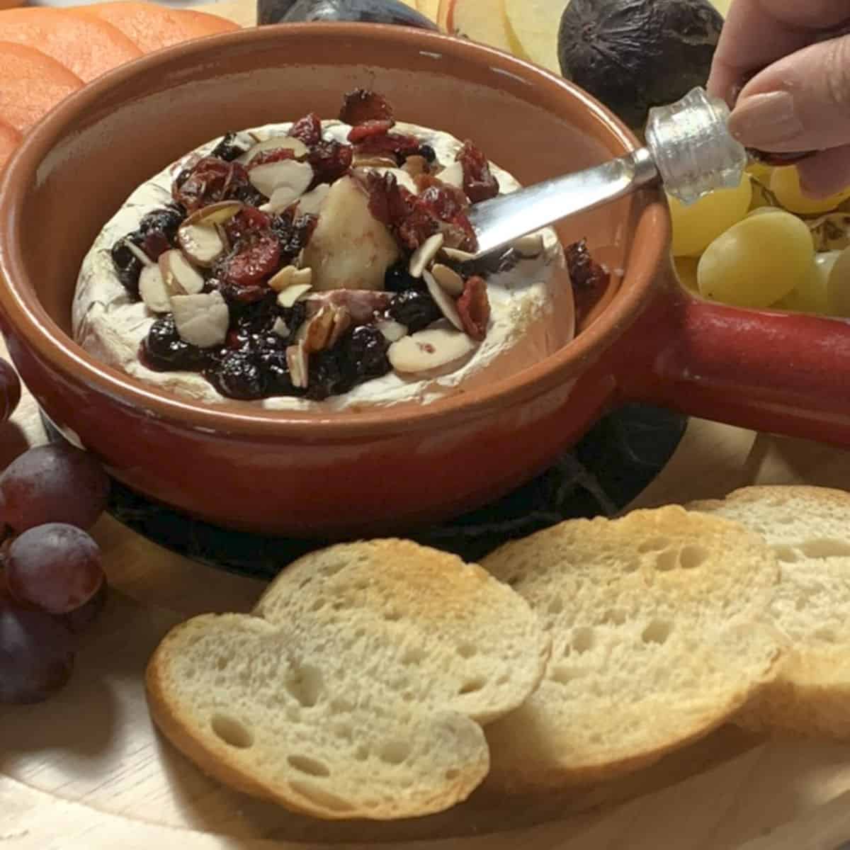 Baked Brie with blackcurrant jam.