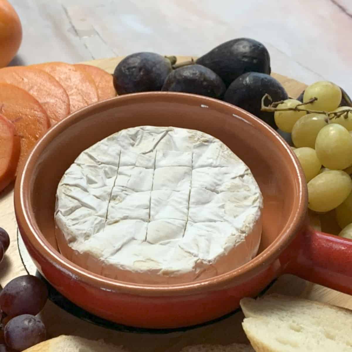 Brie cheese, score the rind.