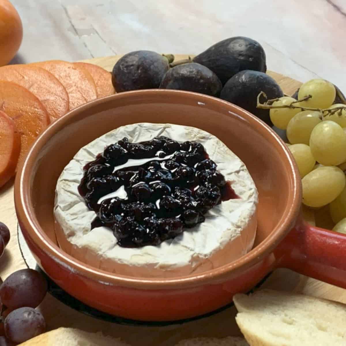 Brie cheese and blackcurrant jam on top.