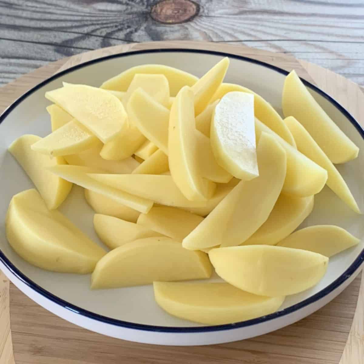 Potatoes cut into wedges.