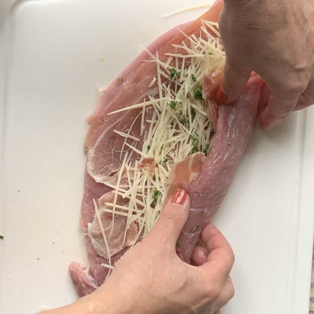 Rolling the meat with the stuffing.