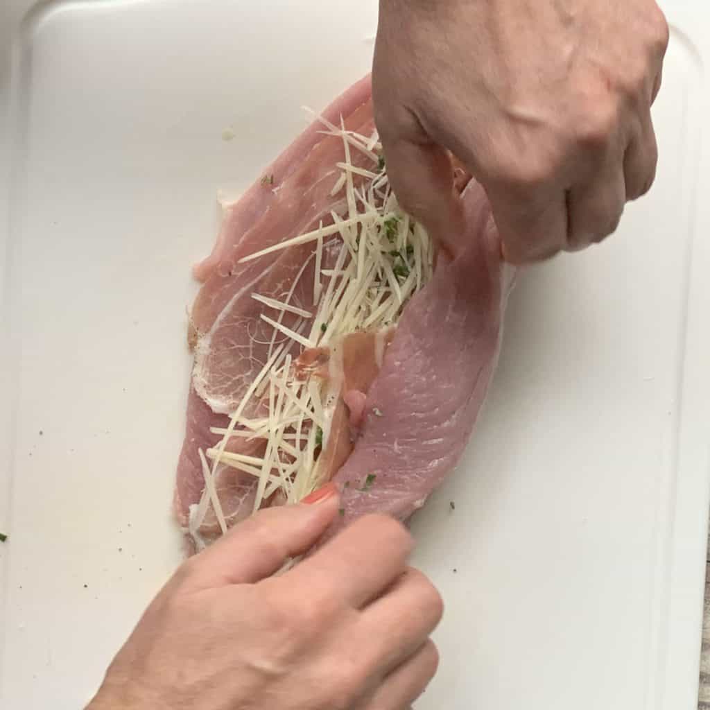Rolling the meat with the stuffing.