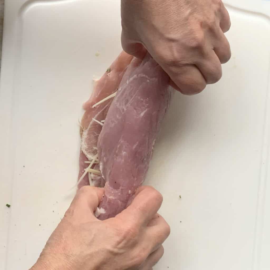 Rolling the meat with the stuffing.