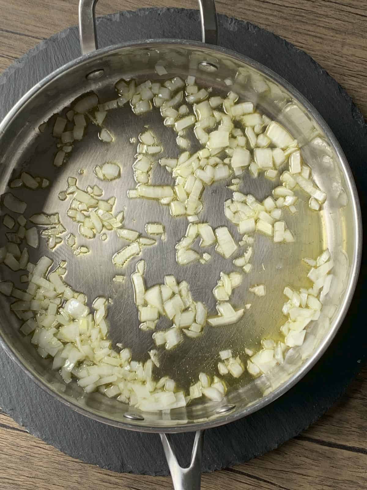 Chipped onions in a sauté pan.