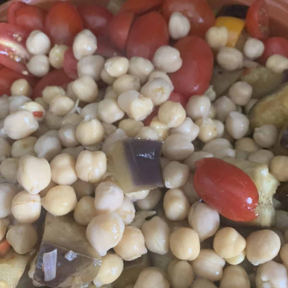 Adding chickpeas to the tajine.