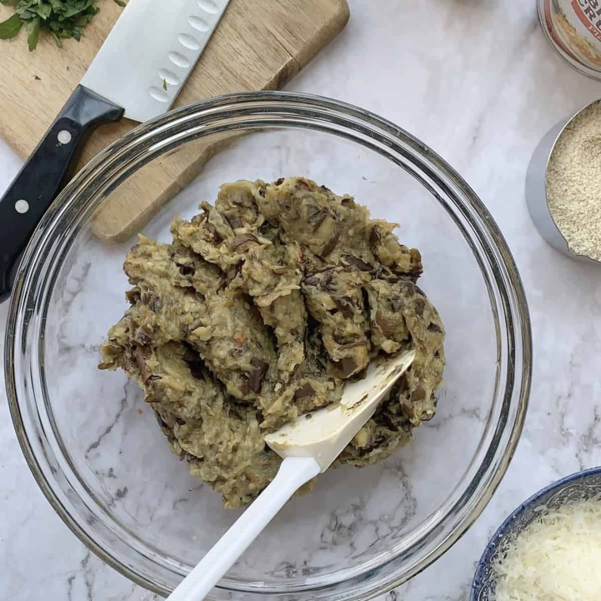 Making eggplant ball mixture.