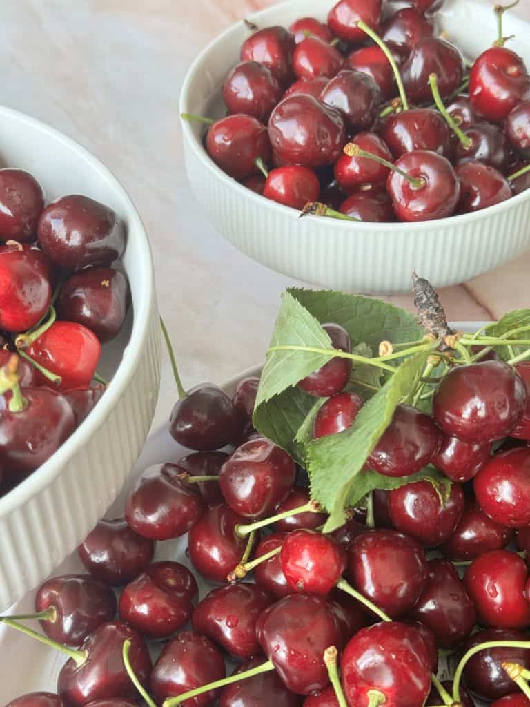Bowls of fresh cherrie.