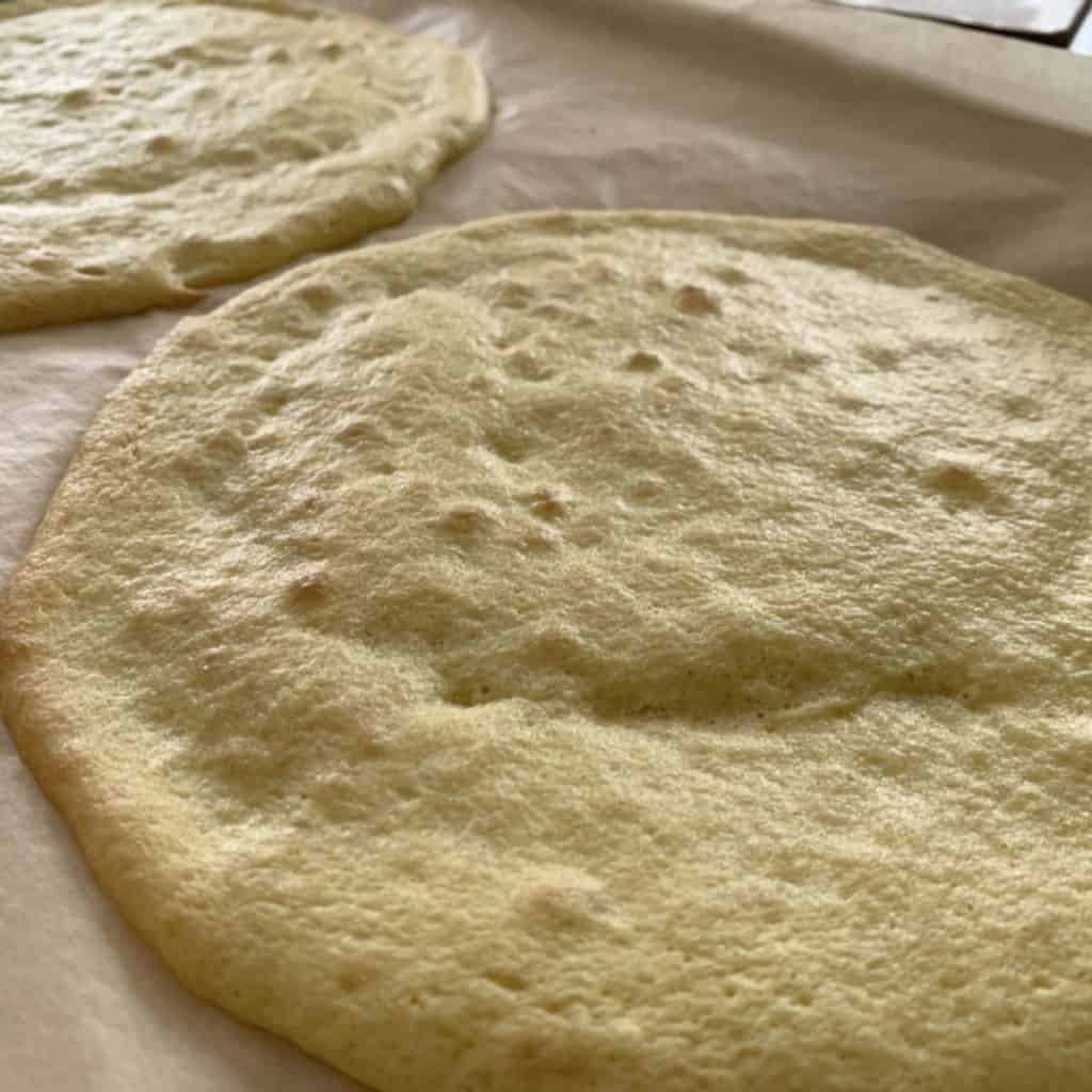 Two cake sheets on a baking tray.