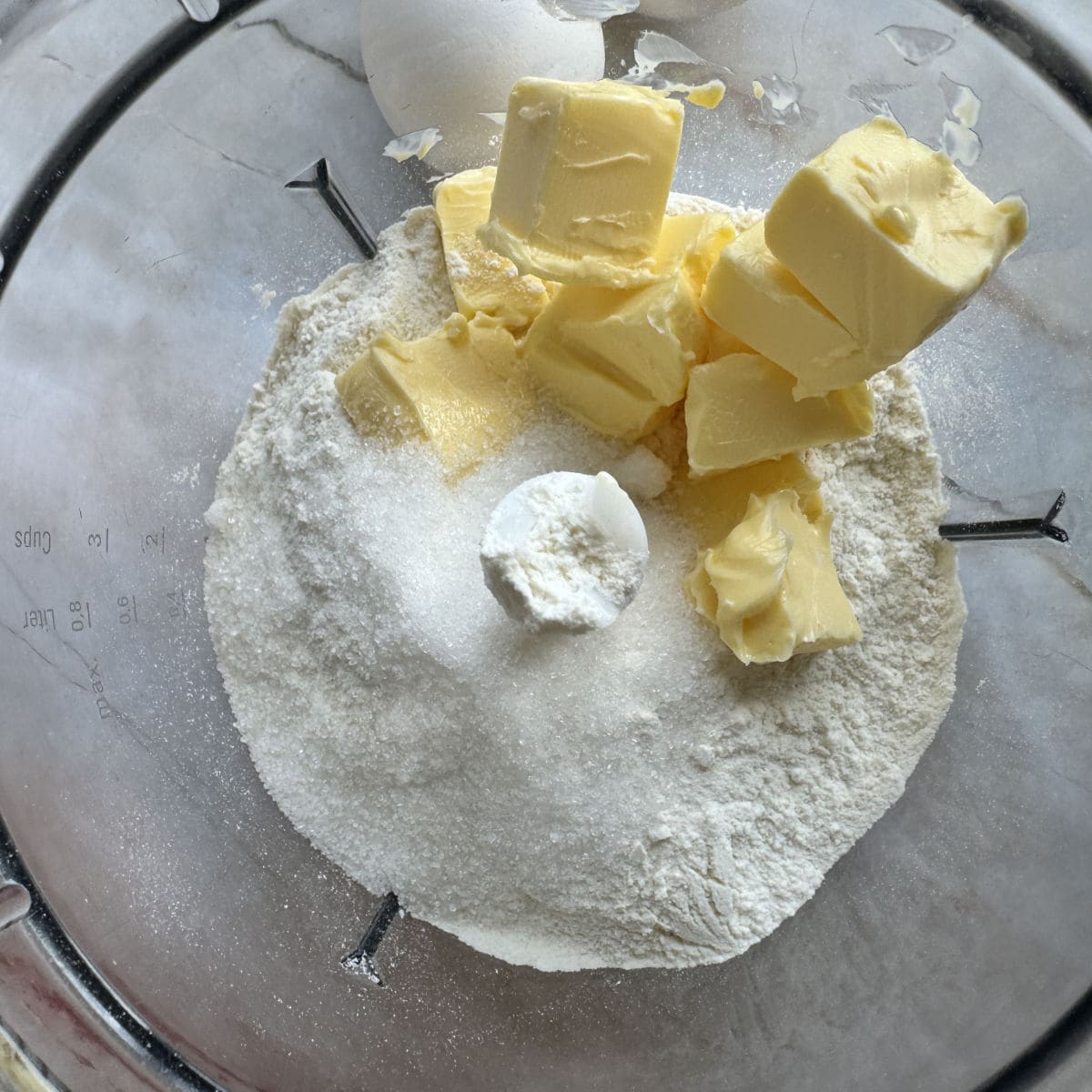 Sugar, flour and butter in a food processor.