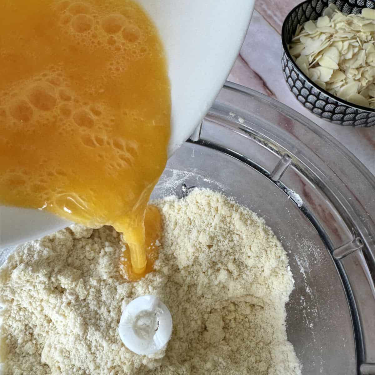 Pouring beaten eggs.