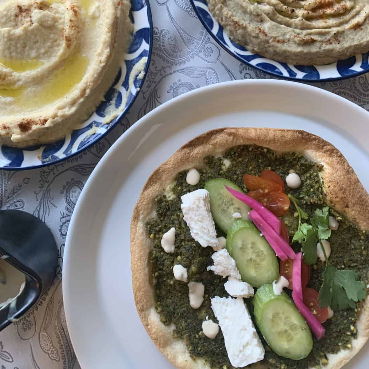 Falafel pizza with hummus and mutabal.