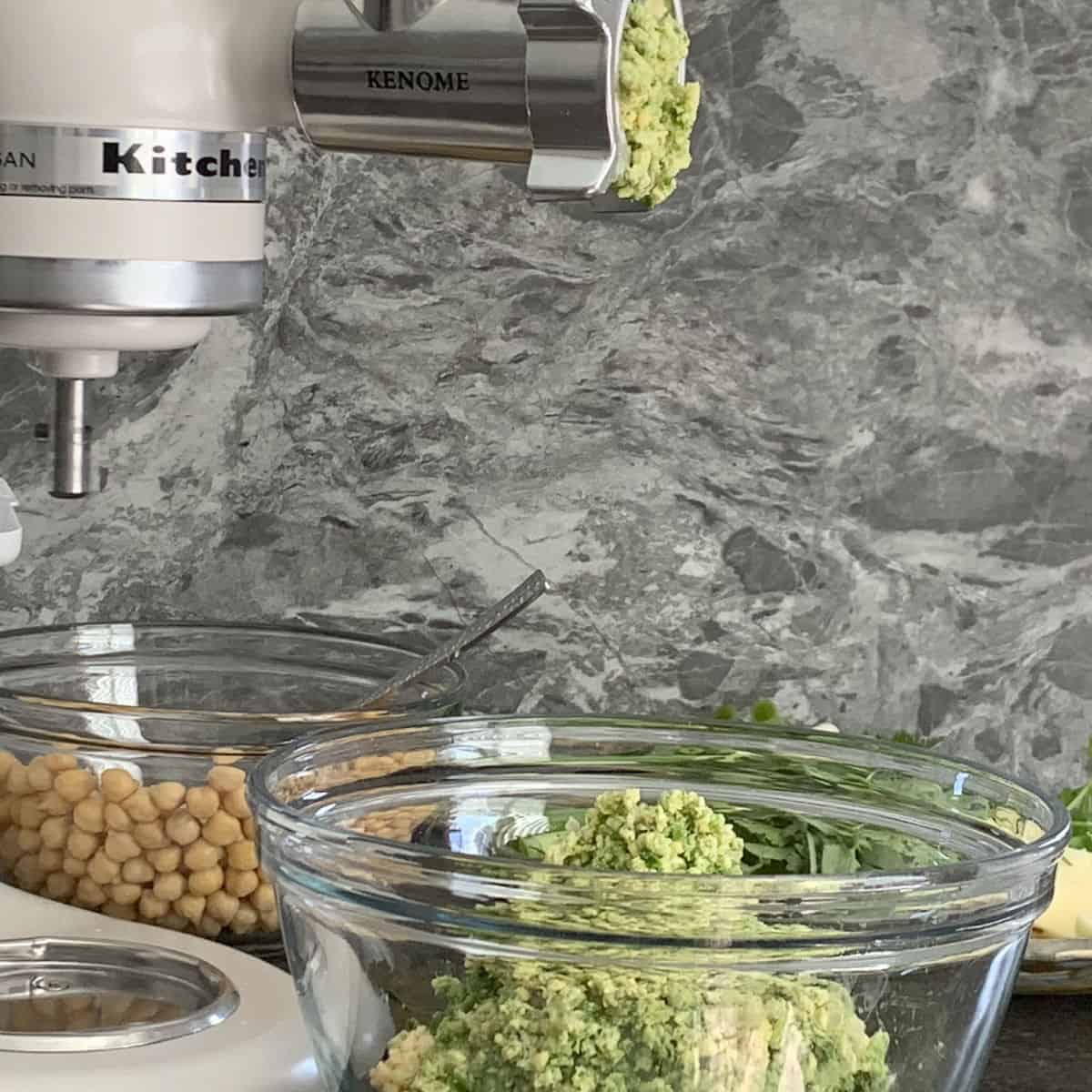 Grinding the chickpeas and greens with kitchen aid mixer.