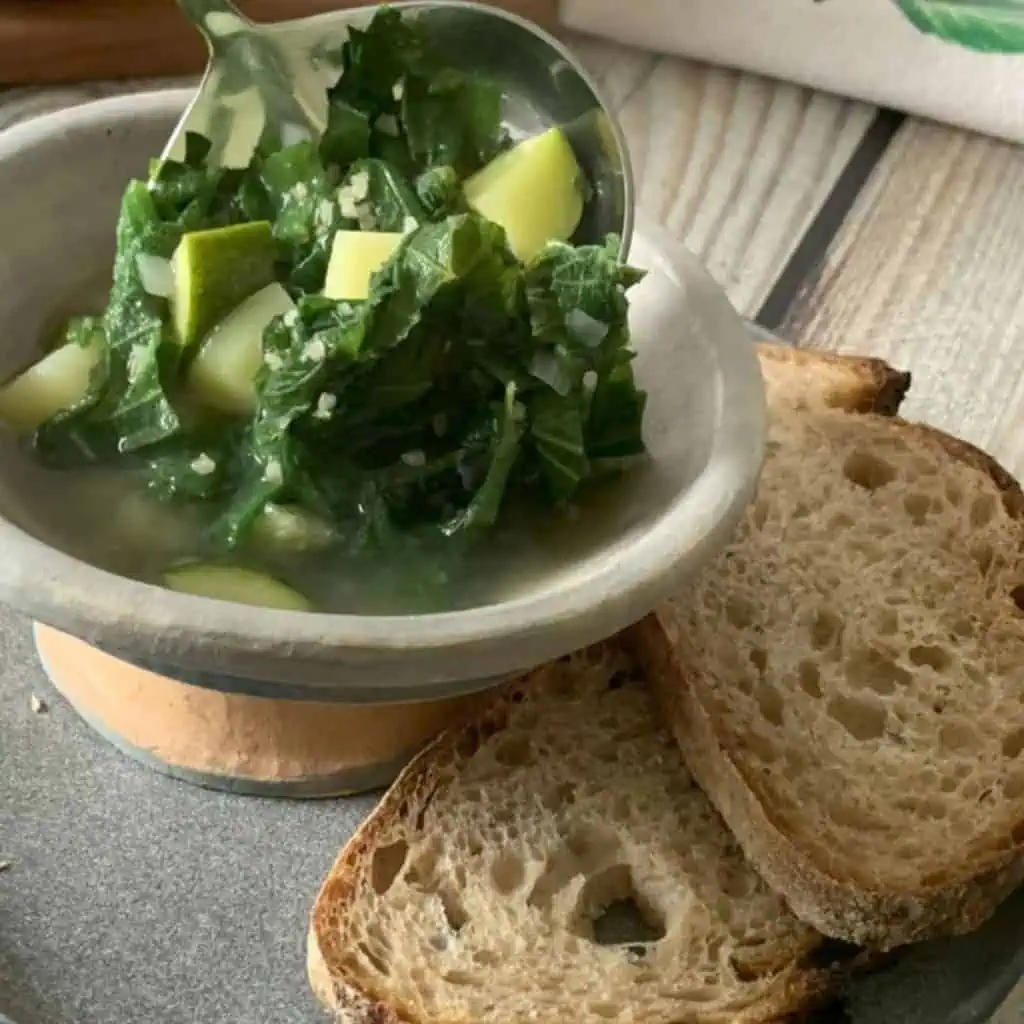 Pouring nettle soup into a bowl.