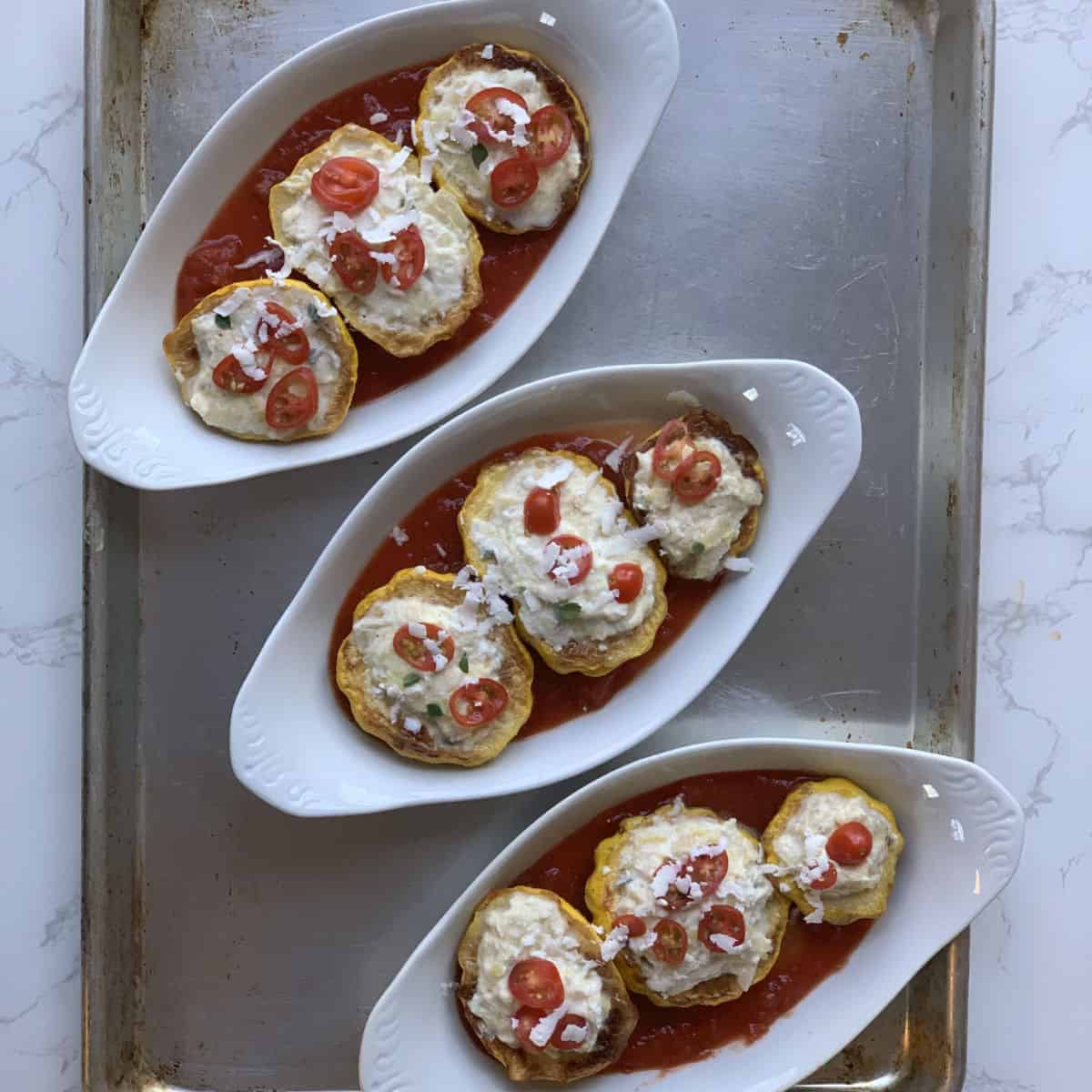 Arranged the pattypan zucchini for baking.