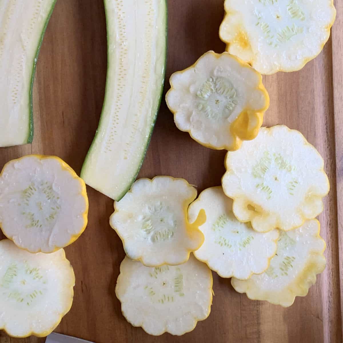 Pattypan zucchini cut in half.