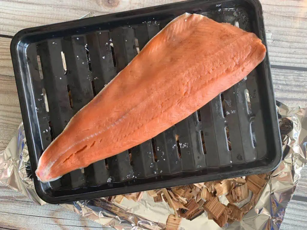 Sockeye salmon fillet with pellicle on wire rack before smoking