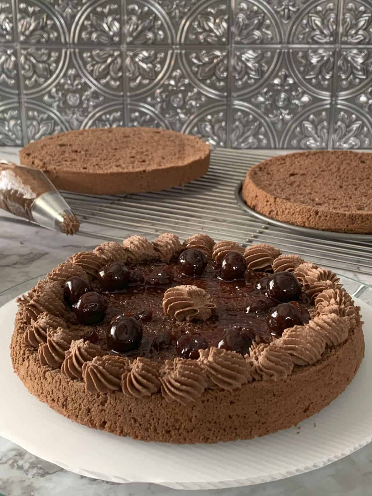 Assembling black forest cake.