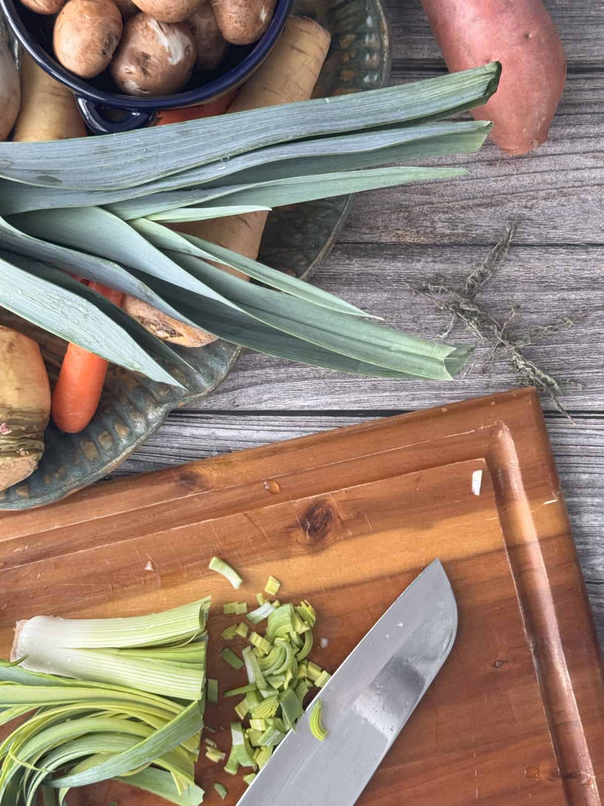 Chopped leeks on a board.