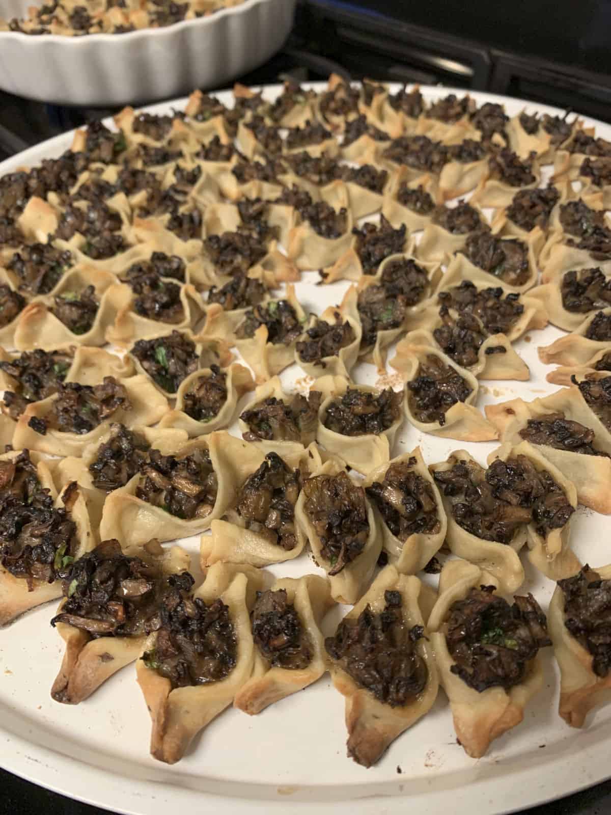 Tray of baked vegetarian manti.