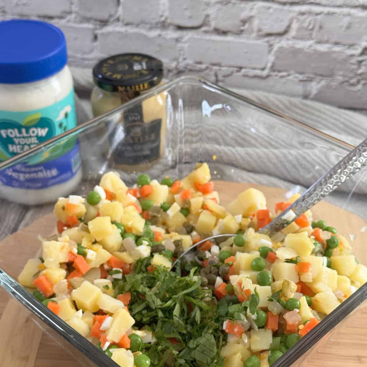 Adding chopped herbs.