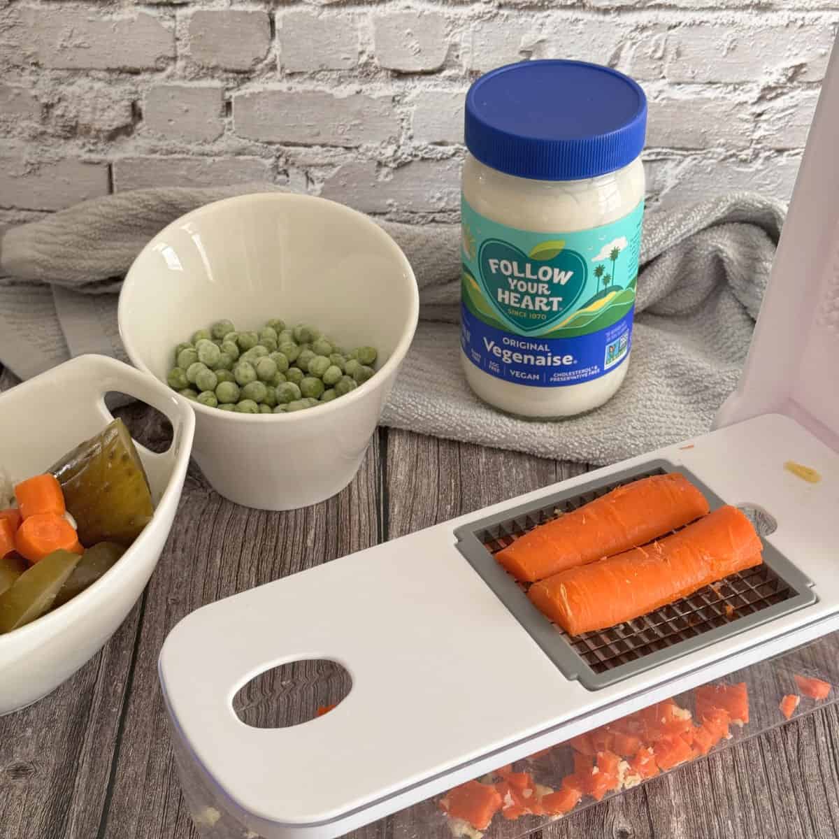 Chopping carrots for olivier salad.