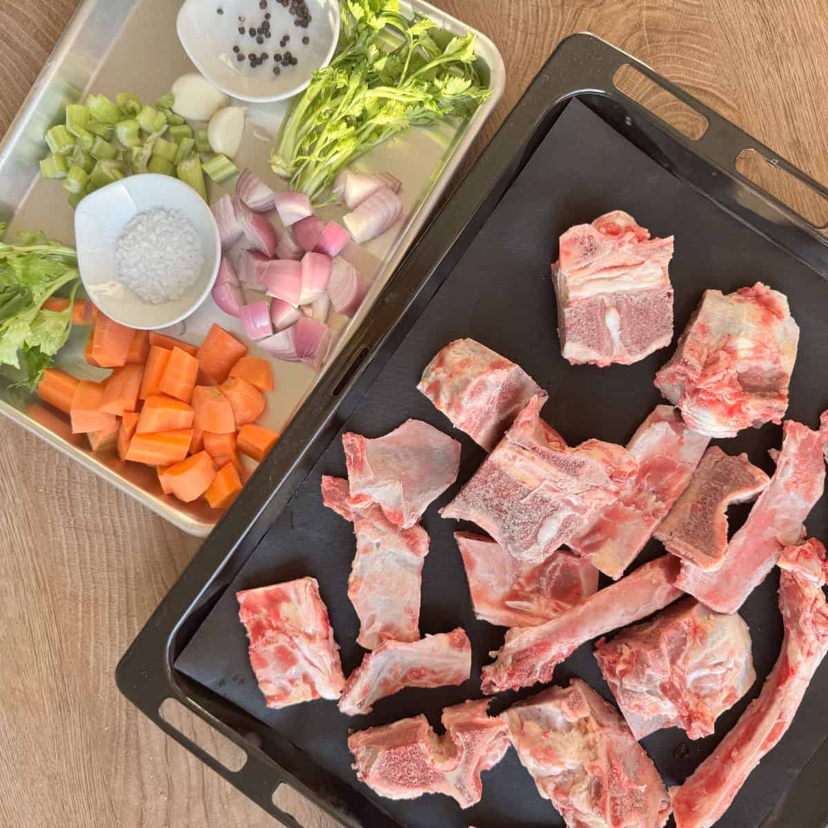 Beef bones and prepared vegetables for the bone broth.
