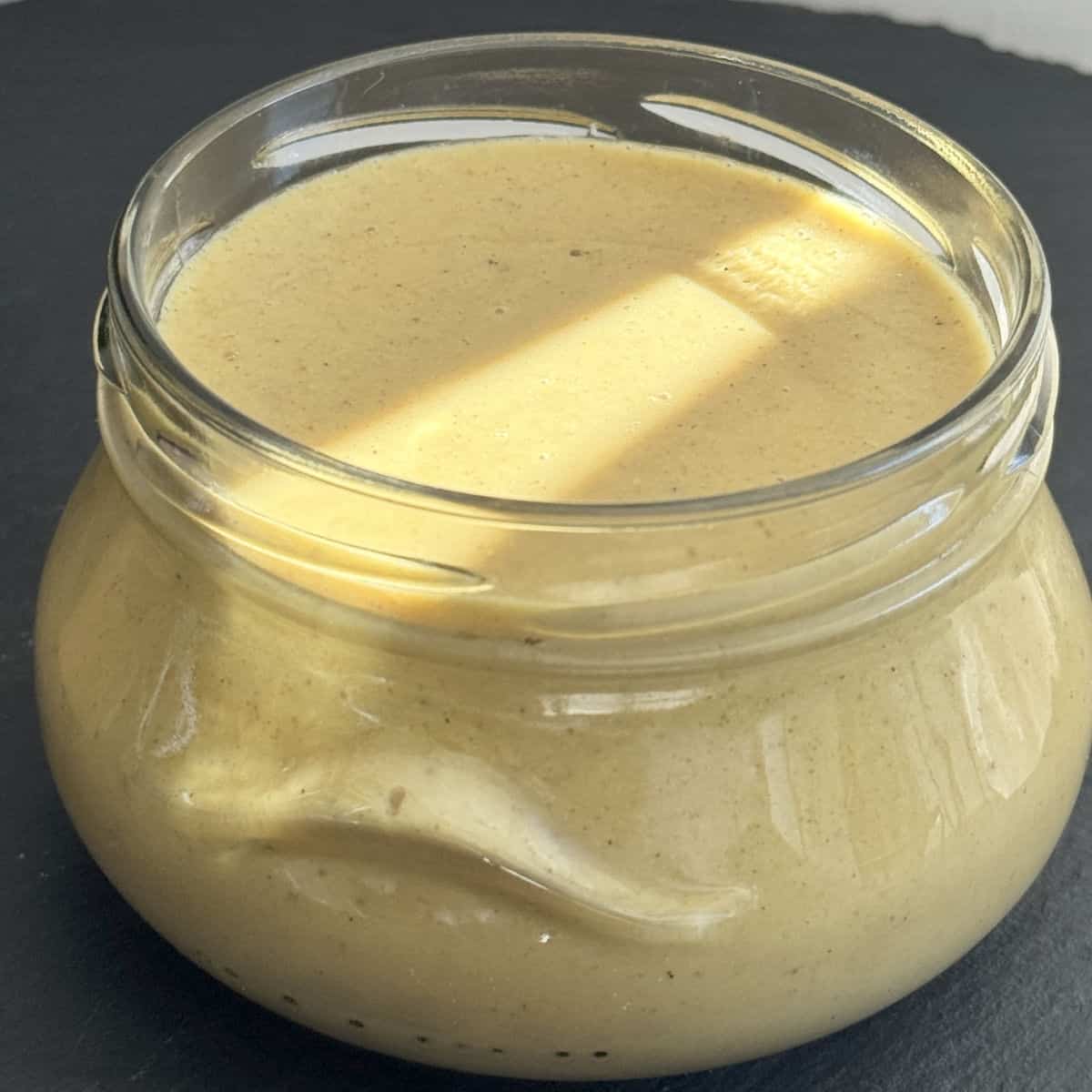 Spicy mustard in a jar.