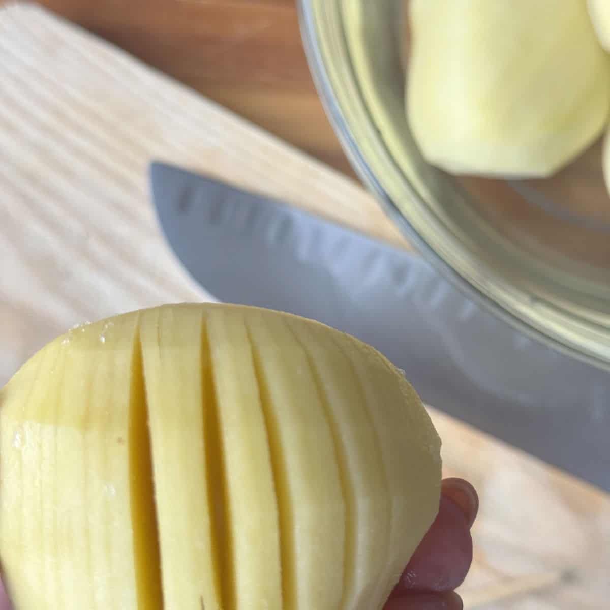 Hasselback potato process shots, showing the slits.