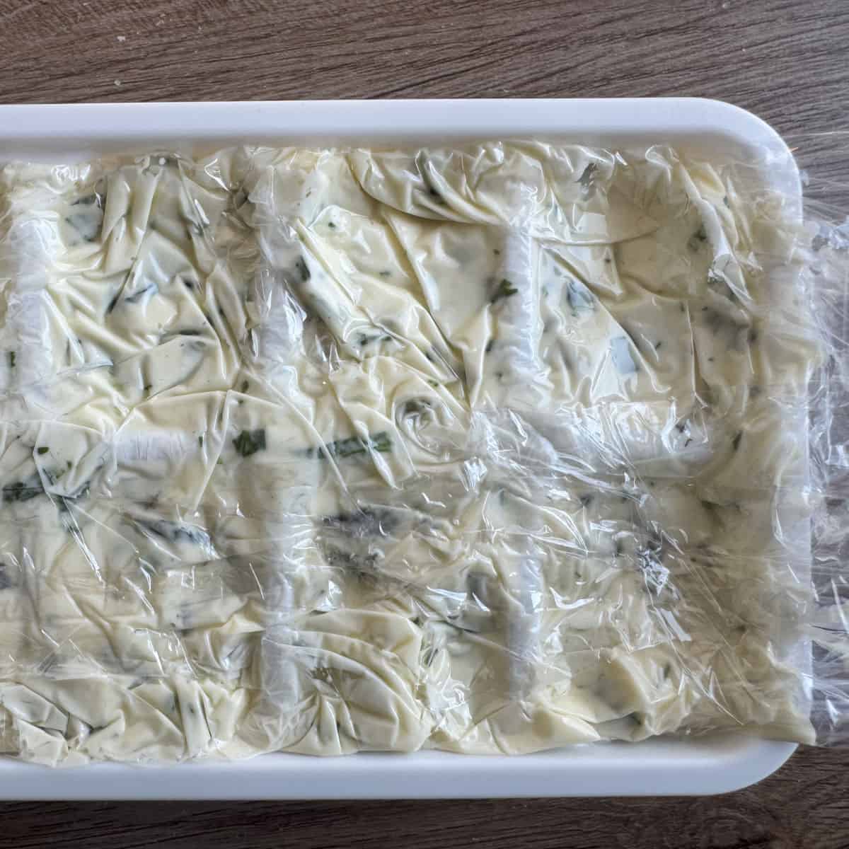 Tarragon compound butter in an ice tray.
