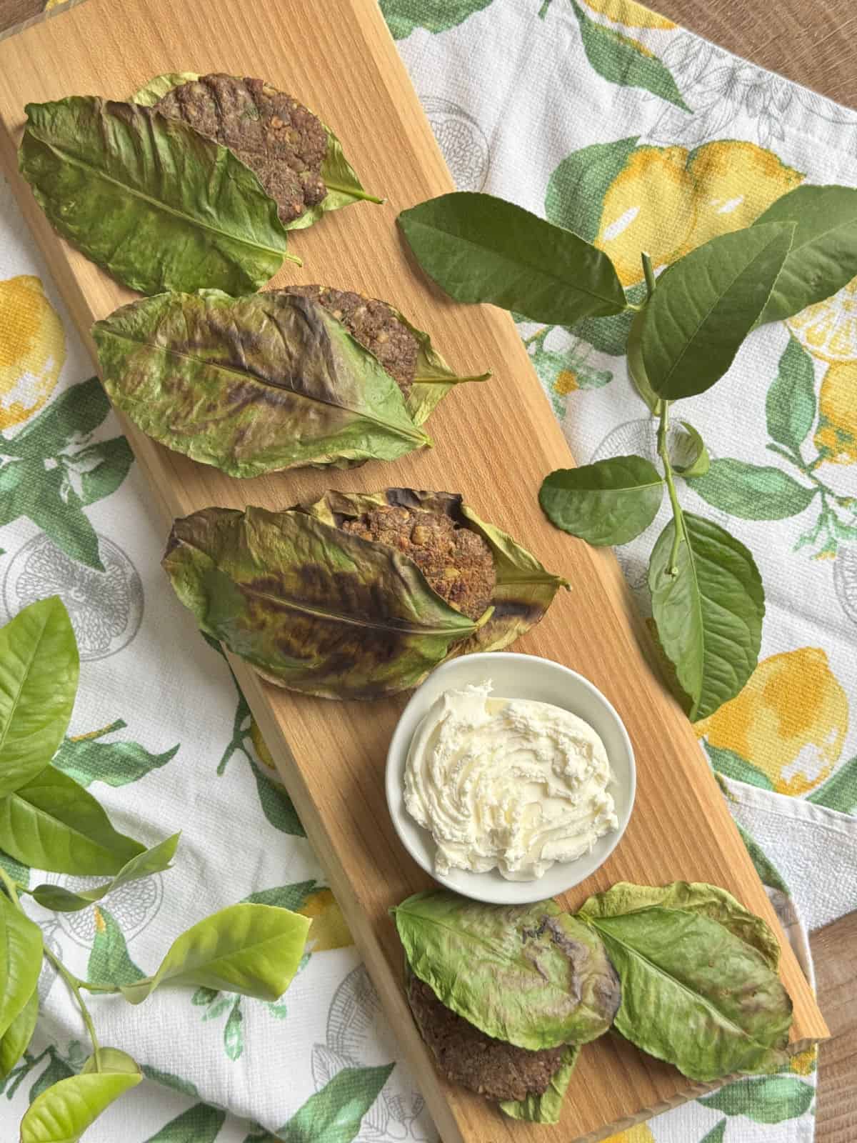Overhead shot of the lentil balls in lemon leaves.