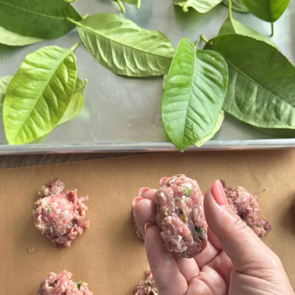 Shaping the meatballs.