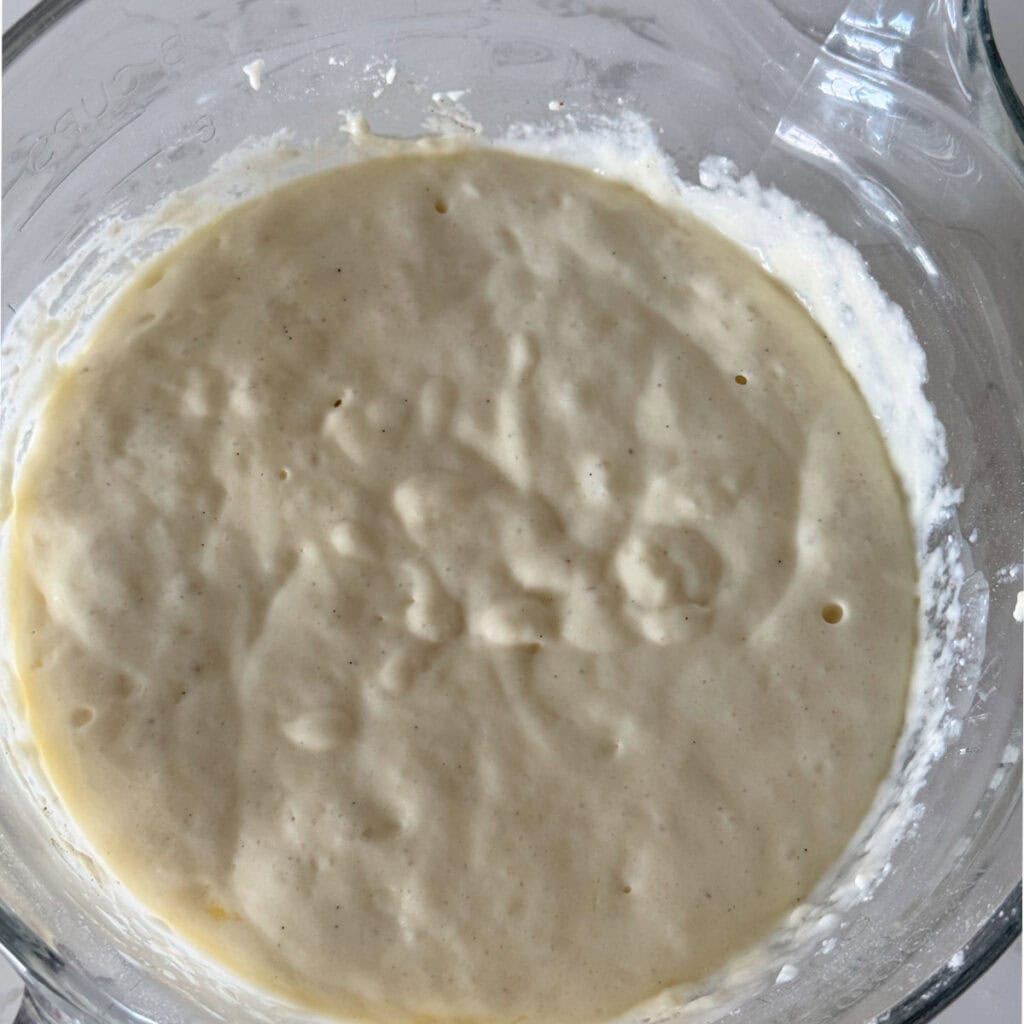 Cooking waffle in a waffle iron.